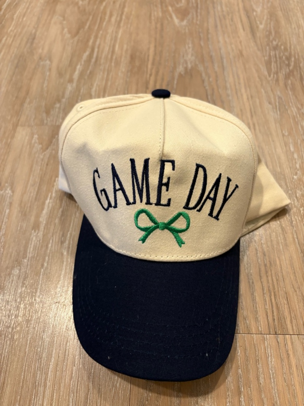 GAME DAY Embroidered Baseball Cap in Cream and Navy with Green Bow